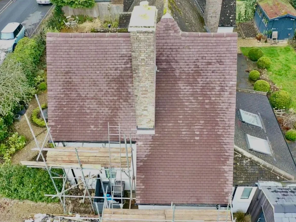 Drone view of tiled roof and chimney
