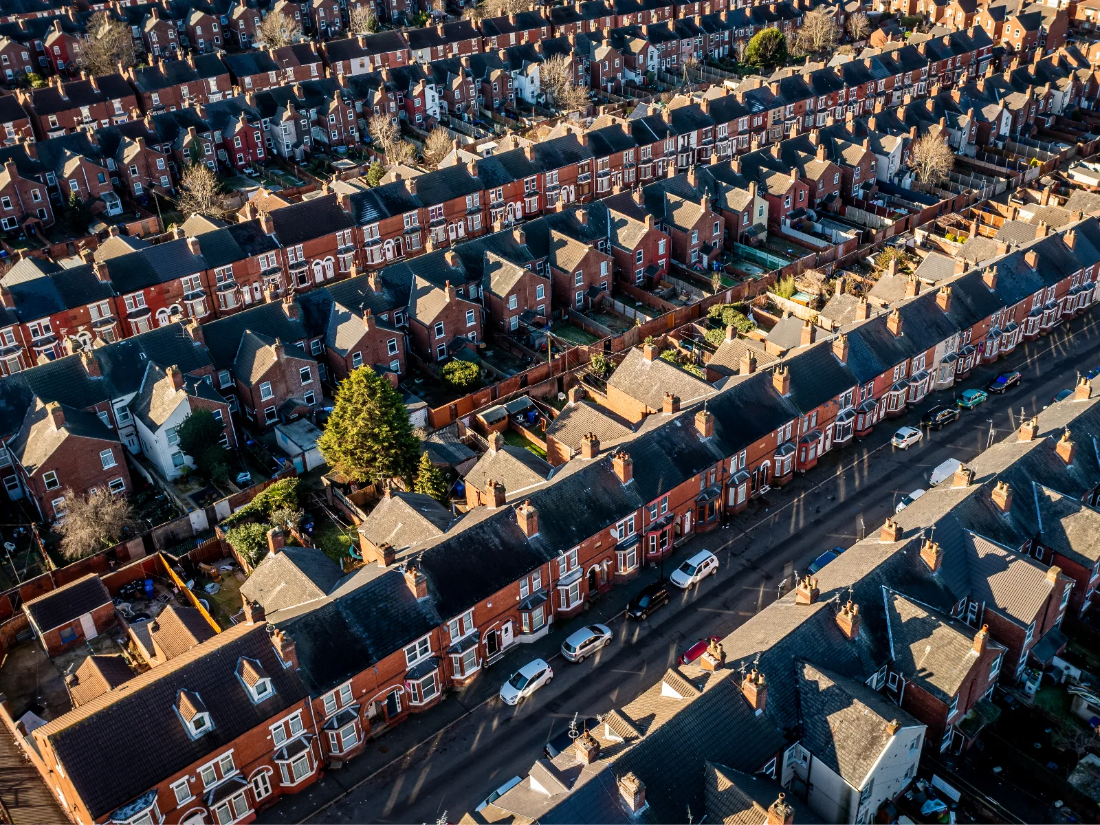 Aerial view of terraced house roofs taken from a drone